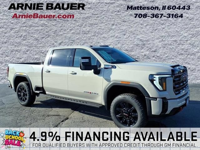 2026 GMC Sierra 2500 HD AT4 in Coastal Dune — front three-quarter view
