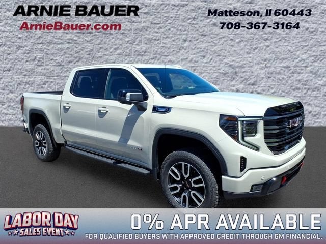 2026 GMC Sierra 1500 AT4 in Coastal Dune — front three-quarter view