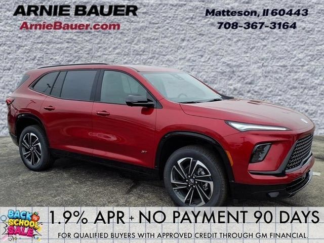 2026 Buick Enclave Sport Touring in Cherry Red Tintcoat — front three-quarter view