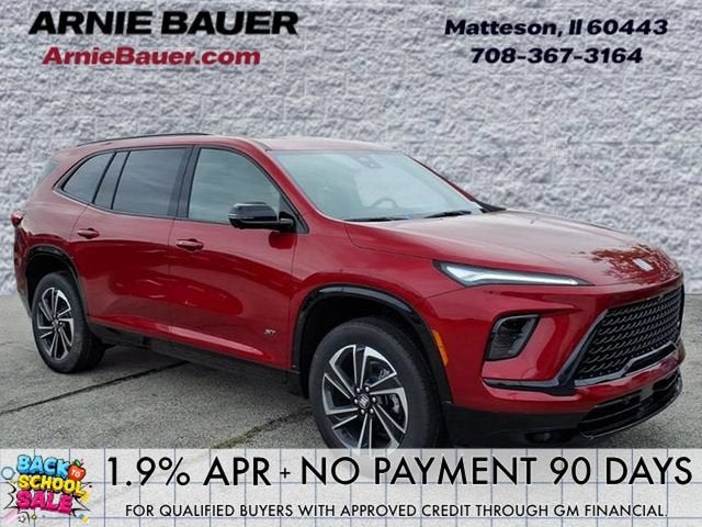 2026 Buick Enclave Sport Touring in Cherry Red Tintcoat — front three-quarter view