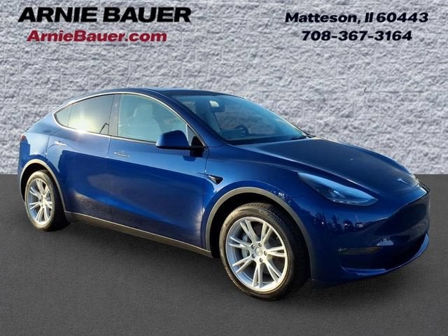2023 Tesla Model Y Long Range in Deep Blue Metallic — front three-quarter view